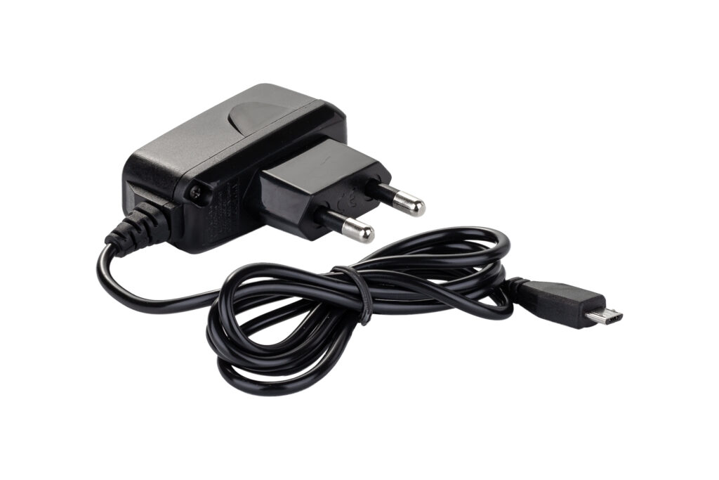 black power adapter with micro usb cable isolated on white
